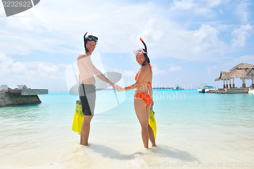 Image of happy young couple have fun on beach