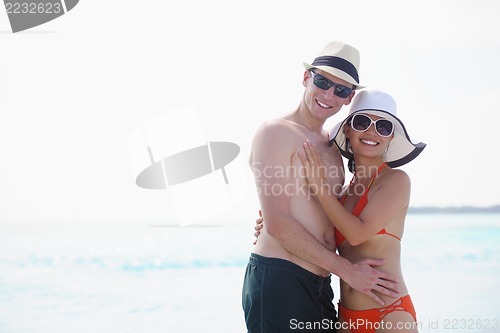 Image of happy young couple have fun on beach