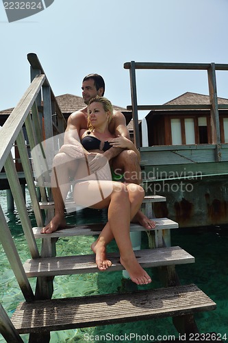 Image of happy young  couple at summer vacation have fun and relax at bea