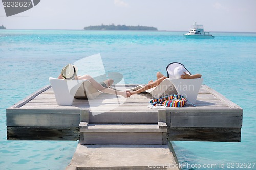Image of happy young couple have fun on beach