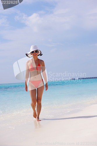 Image of beautiful gril on beach have fun
