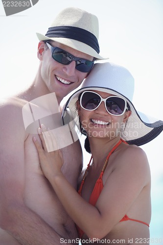 Image of happy young couple have fun on beach