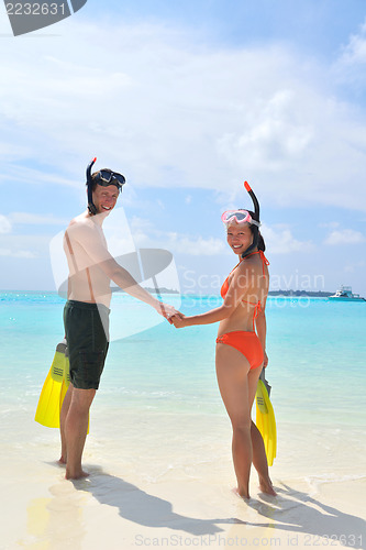 Image of happy young couple have fun on beach