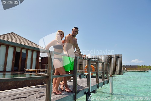 Image of happy young  couple at summer vacation have fun and relax at bea