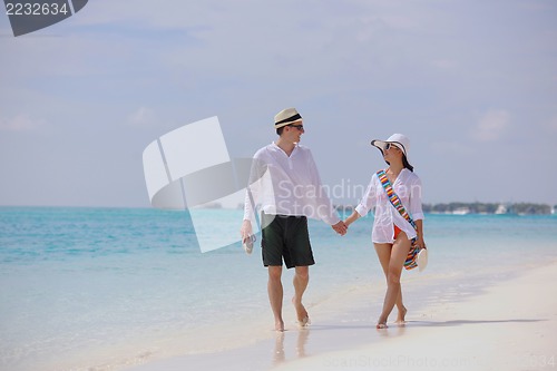Image of happy young couple have fun on beach
