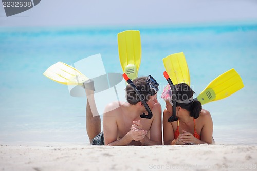 Image of happy young couple have fun on beach