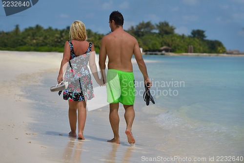 Image of happy young  couple at summer vacation have fun and relax at bea