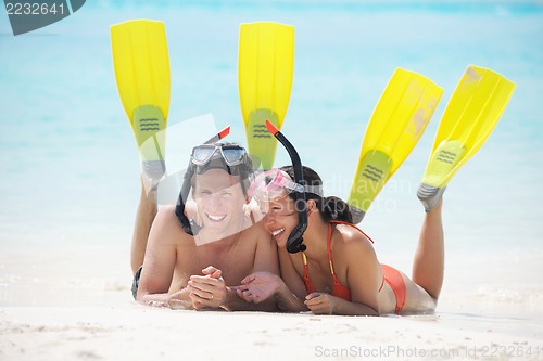Image of happy young couple have fun on beach