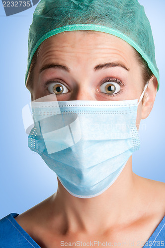 Image of Surprised Female Surgeon with face mask