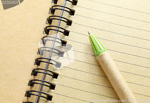 Image of spiral notebook with pen 