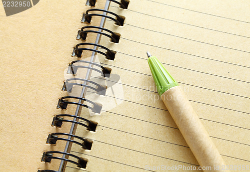 Image of spiral notebook with pen 