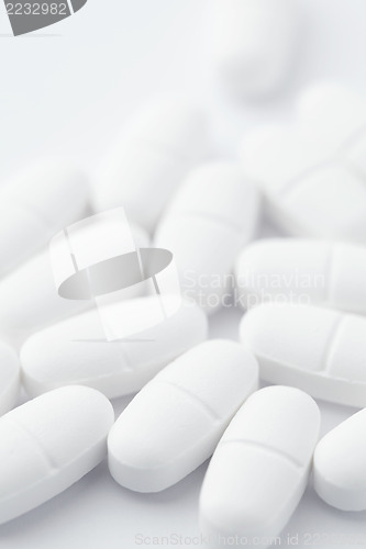 Image of White pills on white