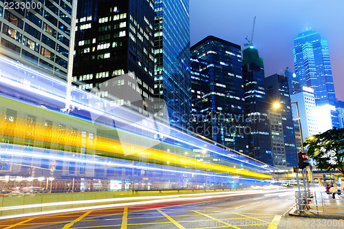 Image of busy traffic road in city at night