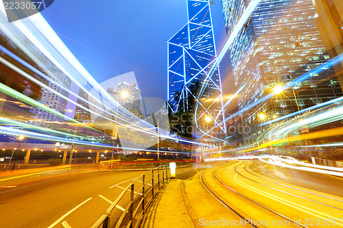 Image of busy traffic road in city at night