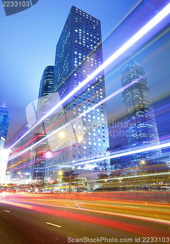 Image of busy traffic road in city at night