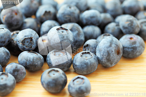 Image of Blueberry on wooden background 