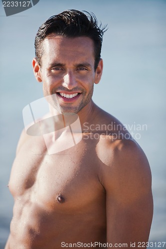 Image of Portrait of a bare chested man smiling