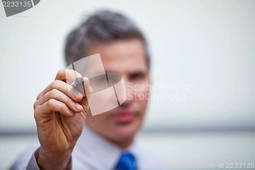 Image of Businessman pointing with a felt tip pen