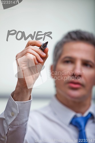 Image of Businessman writing with a felt tip pen
