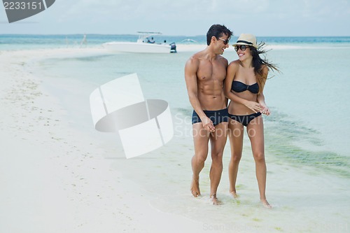 Image of Couple enjoying on the beach