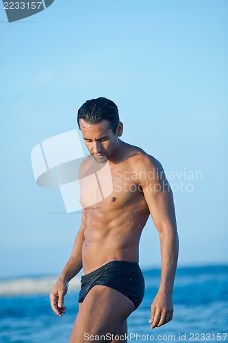 Image of Man standing on the beach