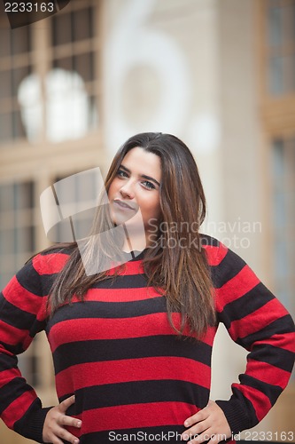 Image of Young woman  overweight with hands on waist