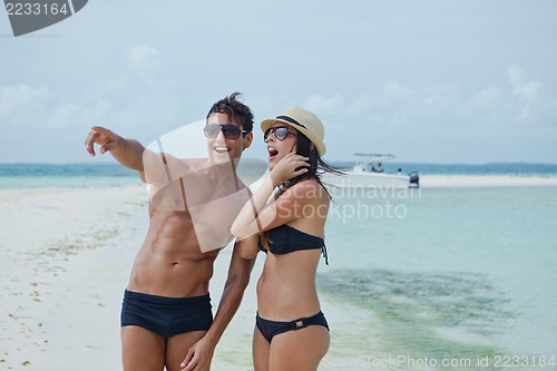 Image of Couple enjoying on the beach