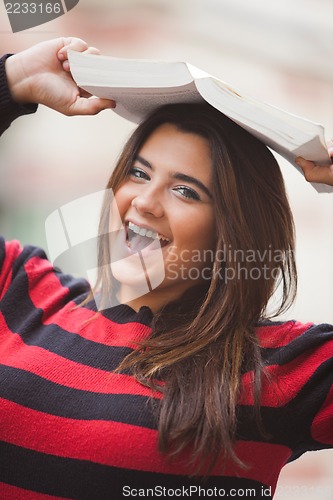 Image of Woman overweight with book