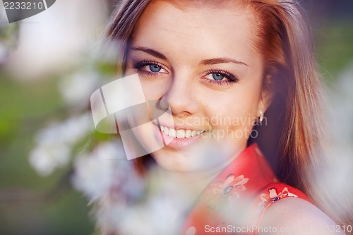 Image of Girl in the flowers of cherry