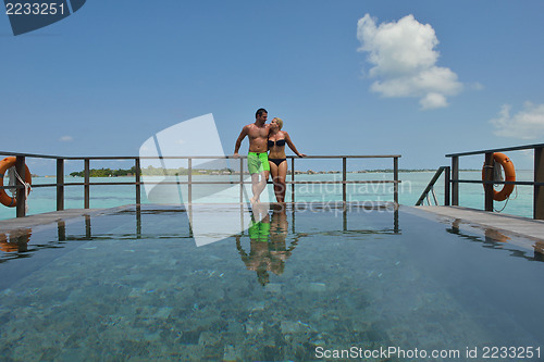 Image of happy young  couple at summer vacation have fun and relax at bea