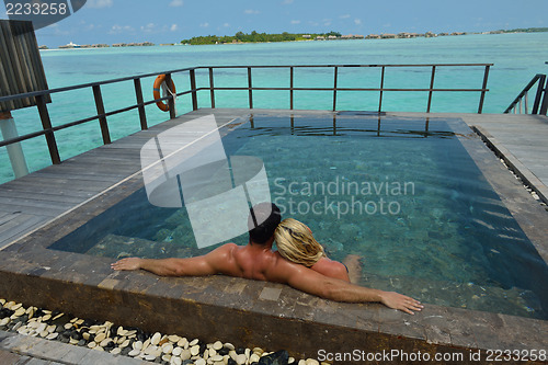 Image of happy young  couple at summer vacation have fun and relax at bea