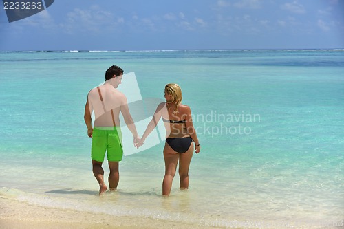 Image of happy young  couple at summer vacation have fun and relax at bea