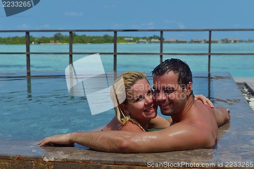 Image of happy young  couple at summer vacation have fun and relax at bea