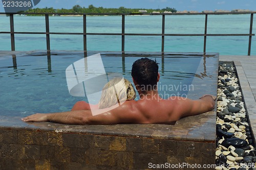 Image of happy young  couple at summer vacation have fun and relax at bea