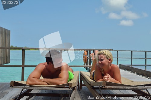 Image of happy young  couple at summer vacation have fun and relax at bea