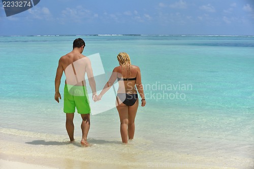 Image of happy young  couple at summer vacation have fun and relax at bea