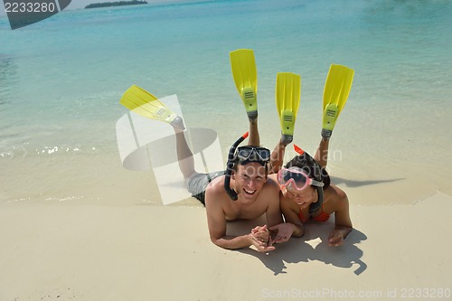 Image of happy young couple have fun on beach