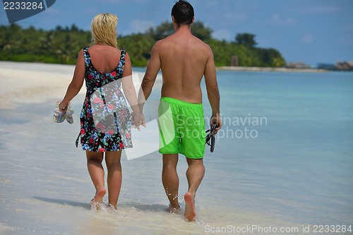 Image of happy young  couple at summer vacation have fun and relax at bea