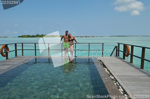 Image of happy young  couple at summer vacation have fun and relax at bea