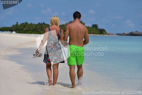 Image of happy young  couple at summer vacation have fun and relax at bea