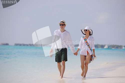 Image of happy young couple have fun on beach