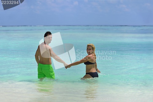 Image of happy young  couple at summer vacation have fun and relax at bea