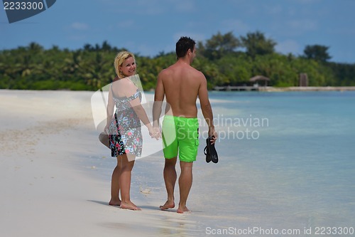 Image of happy young  couple at summer vacation have fun and relax at bea