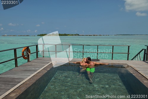 Image of happy young  couple at summer vacation have fun and relax at bea