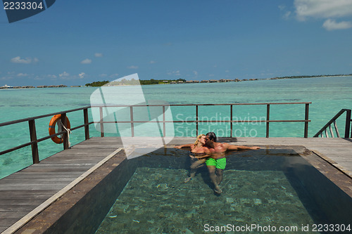 Image of happy young  couple at summer vacation have fun and relax at bea