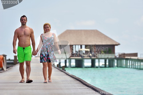 Image of happy young  couple at summer vacation have fun and relax at bea