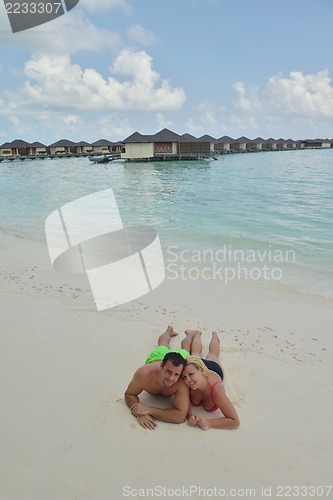 Image of happy young  couple at summer vacation have fun and relax at bea