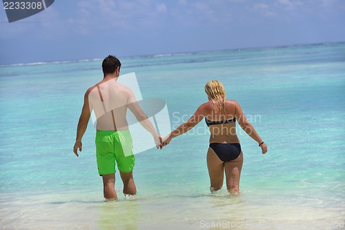 Image of happy young  couple at summer vacation have fun and relax at bea