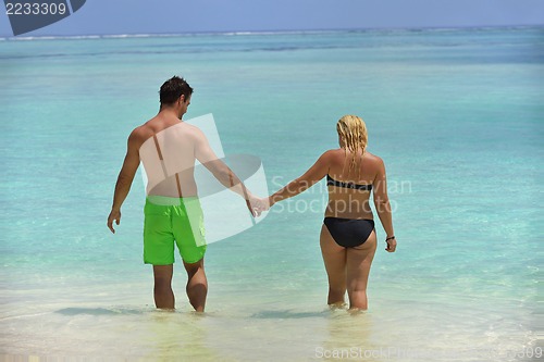 Image of happy young  couple at summer vacation have fun and relax at bea