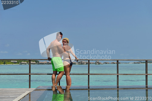 Image of happy young  couple at summer vacation have fun and relax at bea